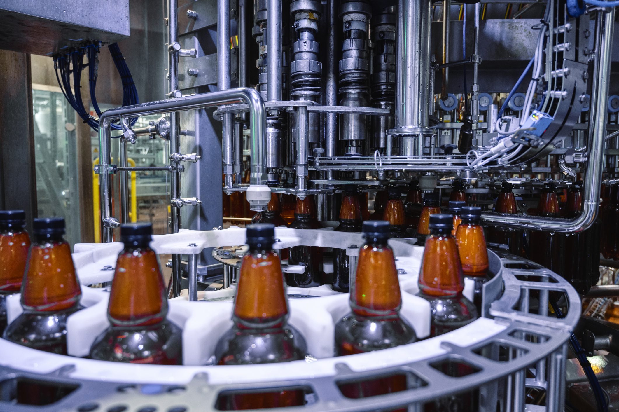 Automatic filling machine, the process of filling plastic bottles with various drinks.