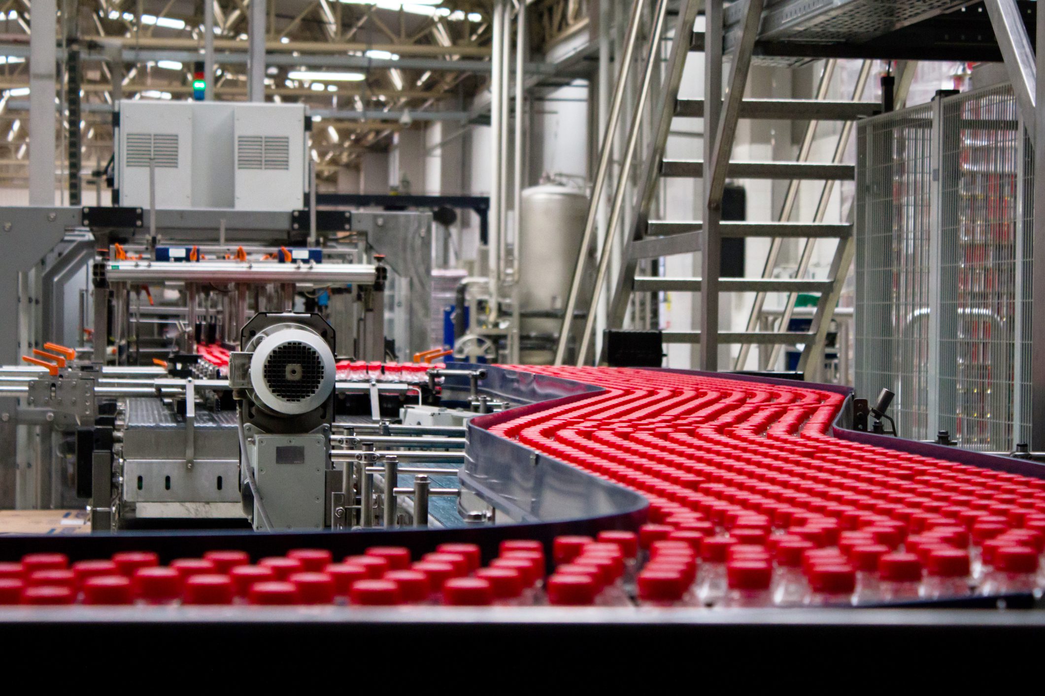 Bottles on conveyor belt in factory